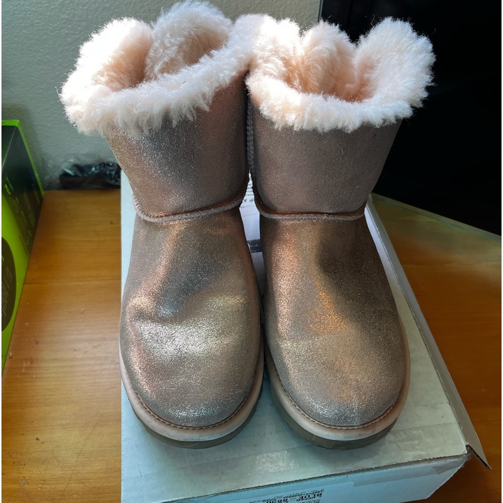 Authentic Ugg boots. Worn once. They are too small for me. Fits like 4 or 4.5.